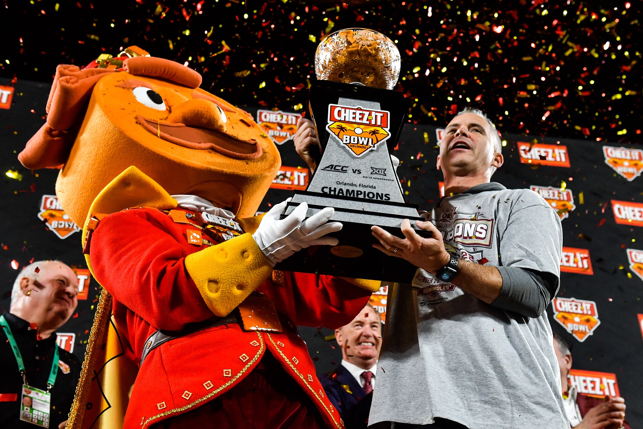 Florida State coach Mike Norvell is presented the Cheez-It Bowl trophy after the Florida State Seminoles defeated the Oklahoma Sooners, 35-32, in the 2022 Cheez-It Bowl in Orlando, Thursday, December 29, 2022. Photo by Harry Castiblanco / Florida National News